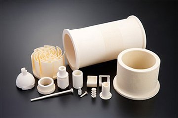 Ivory-toned alumina ceramic components including tubes, sleeves, and small insulators